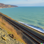 DALL·E 2023-03-04 11.13.22 – railroad along the hill on the coast