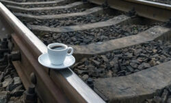 close-up-cup-coffee-train-tracks-cup-coffee-train-tracks-199009775-transformed